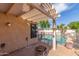 Inviting covered patio with pergola, ideal for outdoor dining and relaxation by the pool at 221 N Ironwood St, Gilbert, AZ 85234