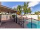 Cozy backyard with pool and covered patio space, great for outdoor activities at 221 N Ironwood St, Gilbert, AZ 85234