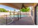 Tranquil backyard pool area with covered patio, offering a relaxing outdoor space at 221 N Ironwood St, Gilbert, AZ 85234