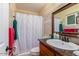 Cozy bathroom featuring a vanity, tiled shower, and neutral decor at 3121 W Greenway Rd, Phoenix, AZ 85053