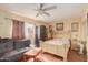 Comfortable bedroom with natural lighting, hardwood floors, and comfortable furnishings at 3121 W Greenway Rd, Phoenix, AZ 85053