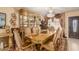 Formal dining room with a chandelier, elegant furniture, and decorative window treatments at 3121 W Greenway Rd, Phoenix, AZ 85053