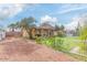Residential home with lush landscaping, mature trees, and an ample driveway at 3121 W Greenway Rd, Phoenix, AZ 85053