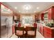 A spacious kitchen with stainless steel appliances, a center island, and abundant wood cabinetry at 3121 W Greenway Rd, Phoenix, AZ 85053