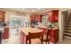 Inviting kitchen featuring dark wood cabinetry and an island perfect for food preparation and casual dining at 3121 W Greenway Rd, Phoenix, AZ 85053