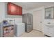 Functional kitchenette space equipped with a refrigerator, freezer, sink, and cabinet storage at 3121 W Greenway Rd, Phoenix, AZ 85053