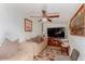 Bright living room with a ceiling fan, comfortable seating, and warm lighting at 3121 W Greenway Rd, Phoenix, AZ 85053