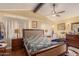 Bright and spacious main bedroom with a ceiling fan and well-lit with lots of windows at 3121 W Greenway Rd, Phoenix, AZ 85053