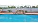 Beautiful backyard pool with rock waterfall feature and privacy wall, perfect for relaxation at 3121 W Greenway Rd, Phoenix, AZ 85053