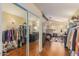 Convenient walk-in closet providing ample storage for clothing and personal items at 3121 W Greenway Rd, Phoenix, AZ 85053