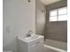 This bathroom has a bright white vanity and shower over the tub, with neutral toned walls at 3636 N 21St Ave, Phoenix, AZ 85015