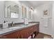 Bathroom featuring a double sink vanity with modern fixtures and a large mirror at 425 E Del Rio Dr, Tempe, AZ 85282