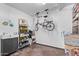 Well-organized garage with workbench, shelving, and a bicycle hung for space-saving storage at 425 E Del Rio Dr, Tempe, AZ 85282