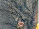 Aerial view of luxury home with a pool and solar panels in a desert landscape at 43105 N 102Nd St, Scottsdale, AZ 85262