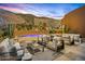 Beautiful backyard oasis featuring a pool, lush desert landscaping, and stunning mountain views at 43105 N 102Nd St, Scottsdale, AZ 85262