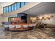 Elegant bar area with custom woodwork, sleek barstools, and mountain views at 43105 N 102Nd St, Scottsdale, AZ 85262