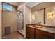Bathroom features a copper sink and granite countertops and glass shower at 43105 N 102Nd St, Scottsdale, AZ 85262