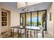 Bright dining room with mountain views, modern chairs, and unique chandelier at 43105 N 102Nd St, Scottsdale, AZ 85262
