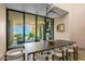 Bright dining area with desert views and an open connection to the outdoor living space at 43105 N 102Nd St, Scottsdale, AZ 85262