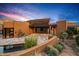 Southwestern-style home with desert landscape, private pool, and stunning desert views at 43105 N 102Nd St, Scottsdale, AZ 85262