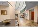 Spacious open concept foyer features high ceilings, clerestory windows and tile flooring at 43105 N 102Nd St, Scottsdale, AZ 85262