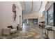 Expansive foyer with soaring ceilings, tile floors, and custom artwork display at 43105 N 102Nd St, Scottsdale, AZ 85262