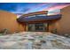 Stunning desert home featuring a grand entrance with stylish stone and a sleek, modern design at 43105 N 102Nd St, Scottsdale, AZ 85262