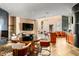 Elegant living room boasts a fireplace, wet bar, tile flooring, and comfortable seating area at 43105 N 102Nd St, Scottsdale, AZ 85262