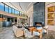 Modern living room with stone accent wall, statement fireplace, and contemporary furniture arrangement at 43105 N 102Nd St, Scottsdale, AZ 85262