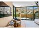 Bright bedroom with view of backyard pool and desert, providing a relaxing indoor-outdoor connection at 43105 N 102Nd St, Scottsdale, AZ 85262