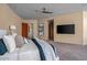 Spacious main bedroom with serene views and luxury details, and a wooden fan at 43105 N 102Nd St, Scottsdale, AZ 85262