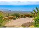 Paver patio with seating and lush desert landscaping featuring mountain views in the background at 43105 N 102Nd St, Scottsdale, AZ 85262