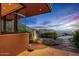 A desert residence boasts serene outdoor space with lush landscaping and majestic mountain views at 43105 N 102Nd St, Scottsdale, AZ 85262