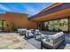 Inviting outdoor patio with comfortable seating, perfect for relaxing and enjoying the desert scenery at 43105 N 102Nd St, Scottsdale, AZ 85262