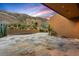 Paver patio with lush desert landscaping, privacy wall, and mountain views at 43105 N 102Nd St, Scottsdale, AZ 85262