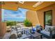 Cozy outdoor seating area with desert landscaping and scenic views, ideal for enjoying the Arizona weather at 43105 N 102Nd St, Scottsdale, AZ 85262