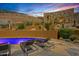 Inviting pool area with comfortable lounge chairs and scenic desert landscaping for ultimate relaxation at 43105 N 102Nd St, Scottsdale, AZ 85262