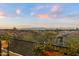 Scenic views from a balcony, showcasing trees and houses below at 6621 N Arizona Biltmore Cir, Phoenix, AZ 85016