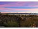 Expansive city view at dusk showcases the lights of the valley from a hillside at 6621 N Arizona Biltmore Cir, Phoenix, AZ 85016
