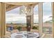 Cozy dining nook with views of desert landscape and an abundance of natural light at 6621 N Arizona Biltmore Cir, Phoenix, AZ 85016
