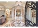 Grand foyer featuring marble floors, soaring columns, and detailed millwork at 6621 N Arizona Biltmore Cir, Phoenix, AZ 85016