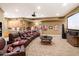 Spacious home theater with tiered seating, wet bar, and snack station for entertaining guests at 6621 N Arizona Biltmore Cir, Phoenix, AZ 85016