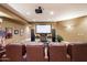 Comfortable home theater with leather seating, large screen, and projector for an immersive movie experience at 6621 N Arizona Biltmore Cir, Phoenix, AZ 85016