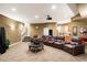 Home theater with a projector, wet bar, and tiered seating for a luxurious viewing experience at 6621 N Arizona Biltmore Cir, Phoenix, AZ 85016