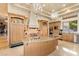 Gourmet kitchen with custom cabinetry and stainless appliances at 6621 N Arizona Biltmore Cir, Phoenix, AZ 85016