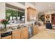 Well-lit kitchen with granite countertops and stainless steel appliances at 6621 N Arizona Biltmore Cir, Phoenix, AZ 85016