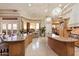 Gourmet kitchen and breakfast nook with scenic views, granite counters and custom cabinets at 6621 N Arizona Biltmore Cir, Phoenix, AZ 85016