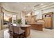 Open floorplan with a spacious kitchen island, breakfast nook, and custom cabinetry at 6621 N Arizona Biltmore Cir, Phoenix, AZ 85016