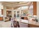 Wet bar with granite counters, mini-fridge, seating, and mountain views at 6621 N Arizona Biltmore Cir, Phoenix, AZ 85016
