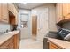 Functional laundry room featuring generous cabinet space and countertops with washer and dryer appliances at 6621 N Arizona Biltmore Cir, Phoenix, AZ 85016